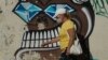 Mujer con máscara camina frente a mural alegórico a COVID-19 en Cuba